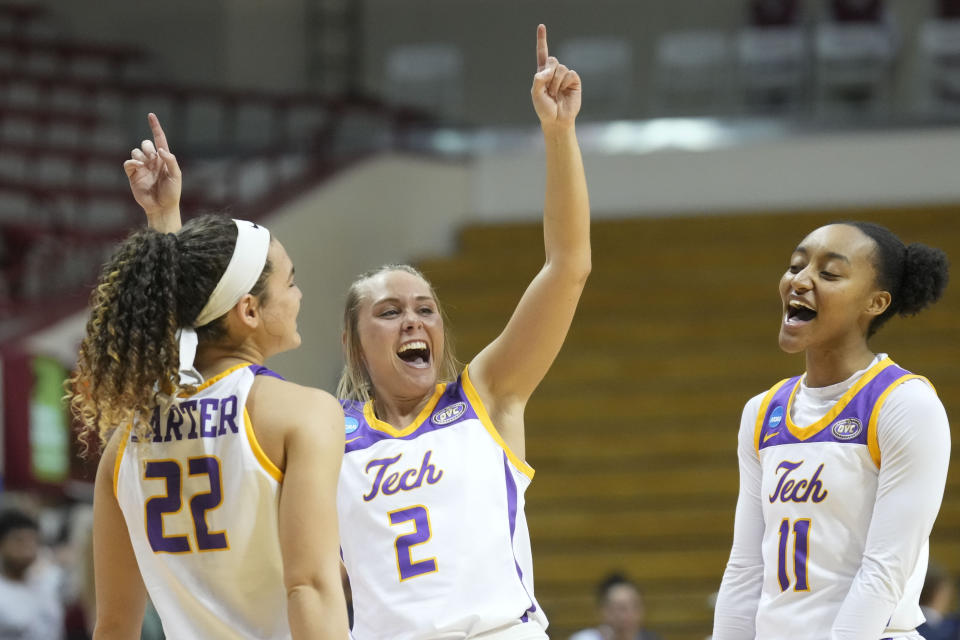Tennessee Techs Jordan Brock (2), Peyton Carter (22) and Maaliya Owens (11) celebrate after defeating Monmouth in an First Four college basketball game in the NCAA women's basketball tournament in Bloomington, Ind., Thursday, March 16, 2023. (AP Photo/AJ Mast)