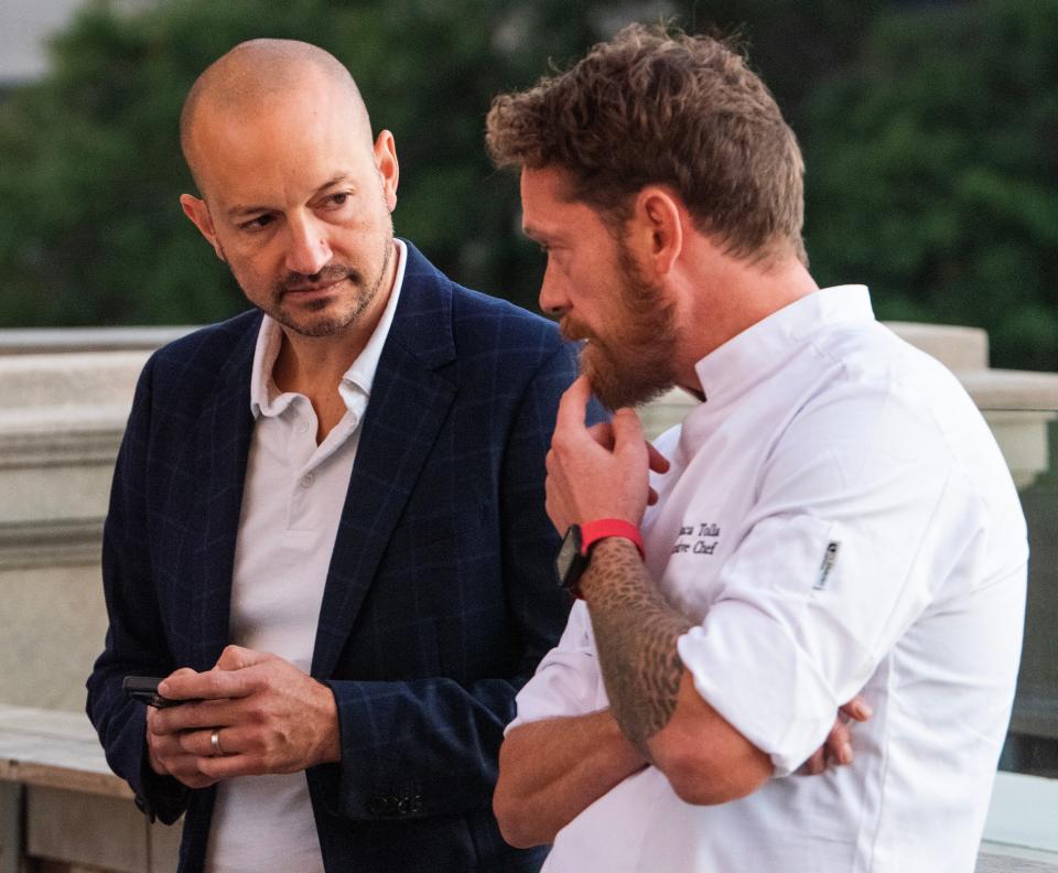 Chef Eric Rivera and Chef Gianluca Tolla chat during a meet-and-greet event Oct. 24 at Bar Attico at Ravello restaurant in Montgomery.