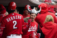 Teammates cheer as Cincinnati Reds' Kevin Newman, center, walks back to the dugout after hitting a two-run home run during the first inning of a baseball game against the Pittsburgh Pirates, Saturday, April 1, 2023, in Cincinnati. (AP Photo/Joshua A. Bickel)