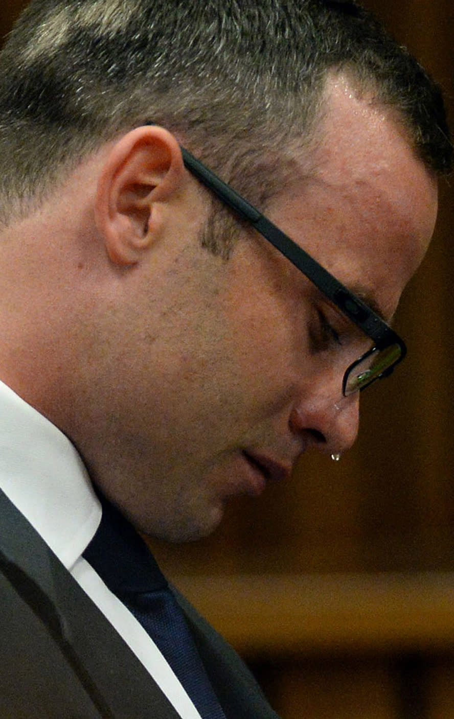 FILE: In this file photo taken Monday, March 24, 2014, Oscar Pistorius, cries in court as he listens to evidence being given in Pretoria, South Africa, in the murder trial for the shooting death of his girlfriend Reeva Steenkamp on Valentines Day 2013. Pistorius is expected to testify soon when the defense begins its case on Friday March 28, 2014, after four weeks of prosecution-led testimony. (AP Photo/Chris Collingridge, Pool, File)