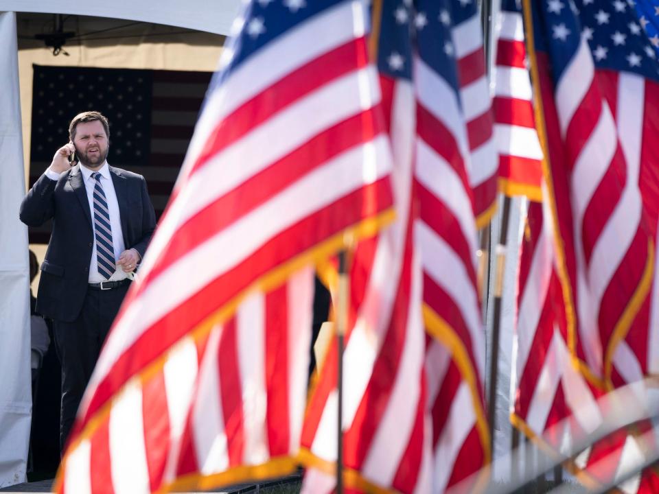 JD Vance talks on the phone backstage during a rally hosted by former President Donald Trump at the Delaware County Fairgrounds on April 23, 2022 in Delaware, Ohio.