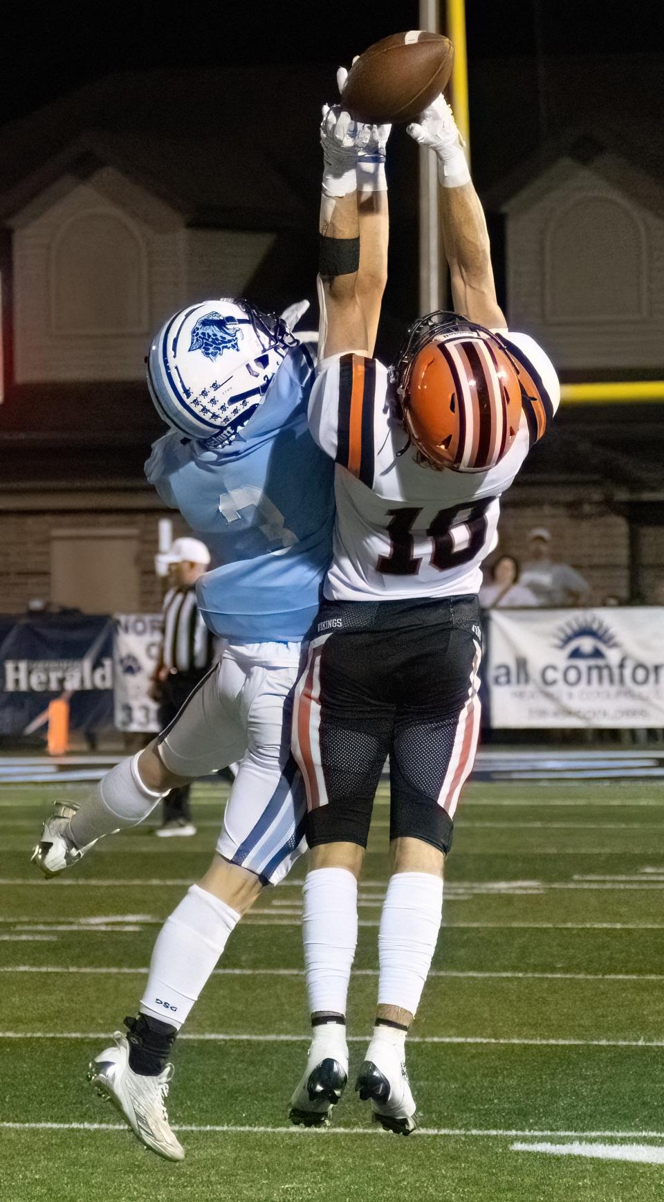 Louisville’s Cooper Rice (3) breaks up a pass intended for Hoover’s Zach Braucher on Friday, Sept. 8, 2023.
