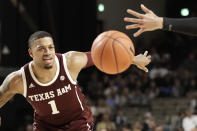 Texas A&M guard Savion Flagg chases after a loose ball against Vanderbilt in the first half of an NCAA college basketball game Saturday, Jan. 11, 2020, in Nashville, Tenn. (AP Photo/Mark Humphrey)