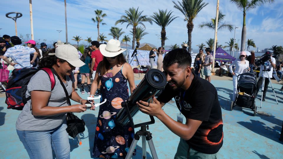 Amateur astronomers prepare to watch a total solar eclipse in Mazatlan, Mexico, on Monday. - Fernando Llano/AP