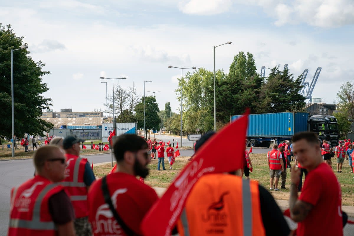 Members of the Unite union man a picket line at one of the entrances to the Port of Felixstowe (Joe Giddens/PA) (PA Wire)