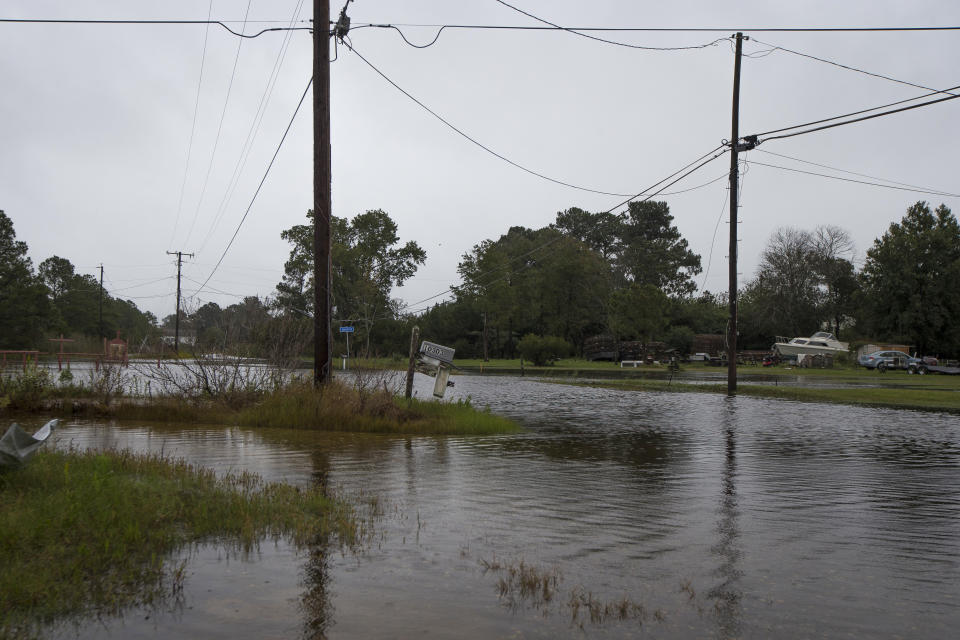 Roads in the Maryus area of Gloucester, Va., are covered by floodwaters after Tropical Storm Ophelia made landfall, bringing rain, damaging winds, and dangerous surges, on Saturday, Sept. 23, 2023. Maryus is a low-level area with a significant amount of saltwater marshland that's prone to flooding. (AP Photo/John C. Clark)