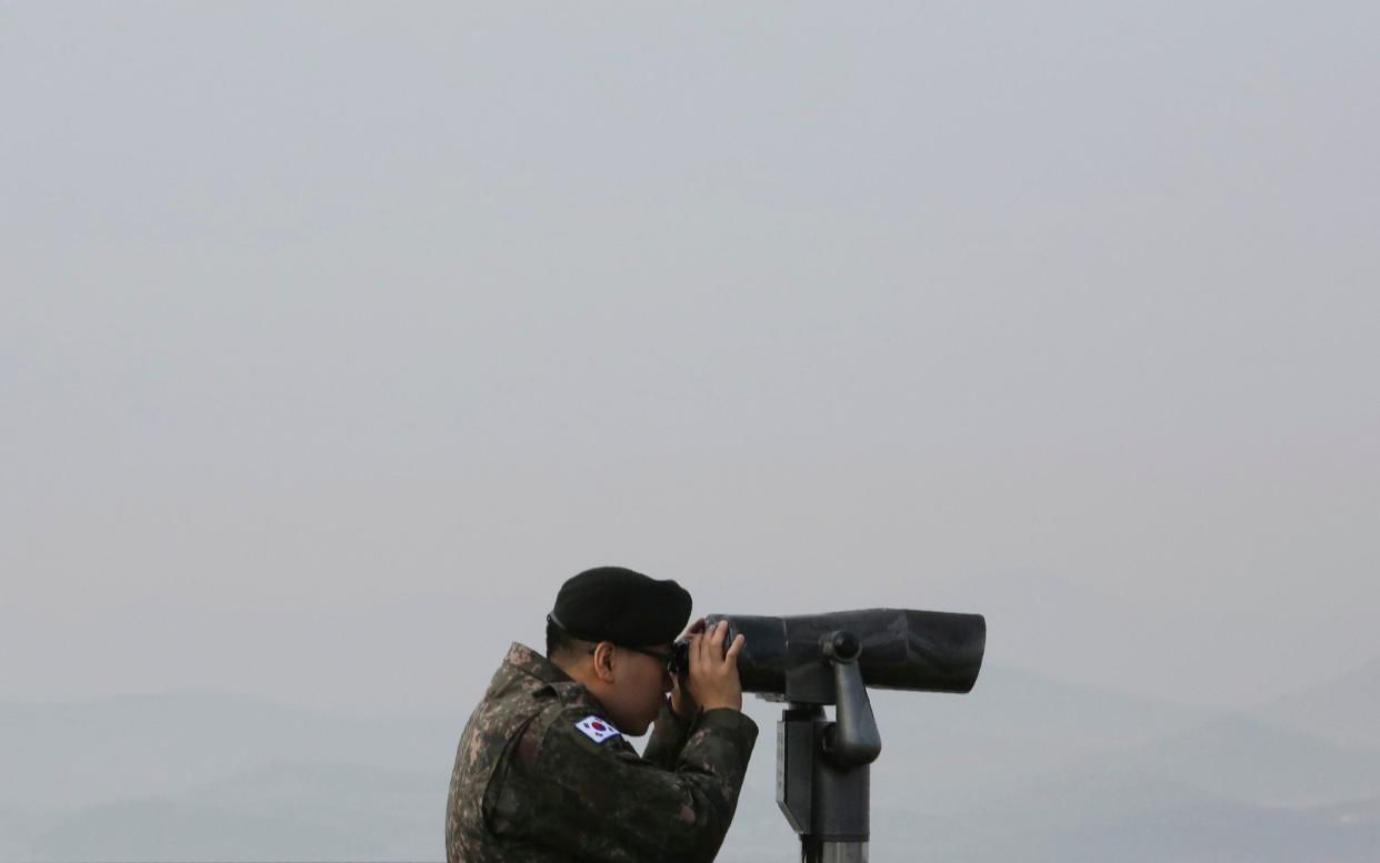 A South Korean soldier keeps an eye on the North. Tensions in the area have increased in recent weeks - AP