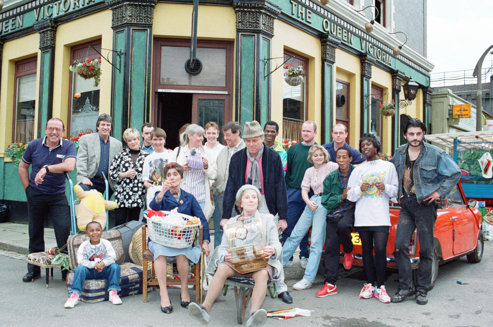 The cast of EastEnders on set. Picture includes Mike Reid, June Brown, John Altman, Letitia Dean, Peter Dean, Daniella Westbrook, Ross Kemp, Steve McFadden, Gretchen Franklin, Adam Woodyatt, Bill Treacher, Todd Carty, Wendy Richard, 28th June 1991. (Photo by Nigel Wright/Mirrorpix/Getty Images)