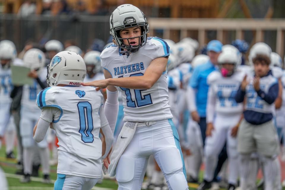 Matt Clements celebrates with Michael Carlino (0)
after their touchdown pass following a Panther fumble recovery.