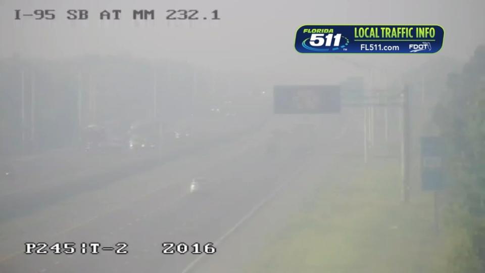 <div>Smoke plume from the Sandy Drain Fire in Volusia County is spotted along I-95. (Photo via Florida 511 traffic camera)</div>