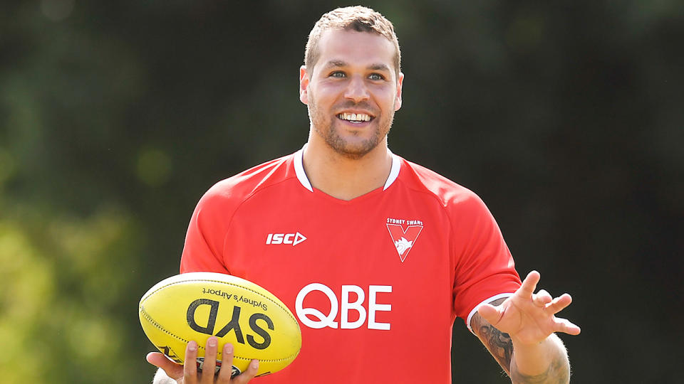 Lance Franklin (pictured) smiling during Swans training.