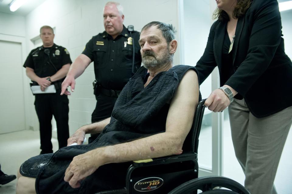 Frazier Glenn Cross, also known as Frazier Glenn Miller, appears at his arraignment in New Century, Kan., Tuesday, April 15, 2014. Cross is being charged for shootings that left three people dead at two Jewish community sites in suburban Kansas City on April 13. At right is Michelle Durrett, attorney with the public defender's office. (AP Photo/The Kansas City Star, David Eulitt, Pool)