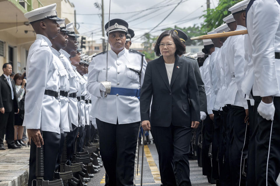 In this photo released by the Taiwan Presidential Office, Taiwanese President Tsai Ing-wen attends a welcome ceremony in St. Lucia on Thursday, July 18, 2019. Tsai said she would follow "humanitarian principles" in dealing with asylum seekers from Hong Kong during a visit this week to Saint Lucia, an eastern Caribbean island nation that is among Taiwan's few remaining allies. (Taiwan Presidential Office via AP)