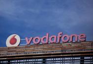 The Vodafone logo can be seen on top of a building outside Madrid, Spain