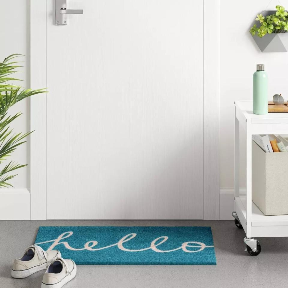 the doormat with "hello" written on it