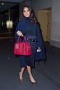 <p>Head to toe in navy, Meghan wears a skirt by Veronica Beard with popping pink Marc Jacobs bag at the 'Today Show', March 2016</p>