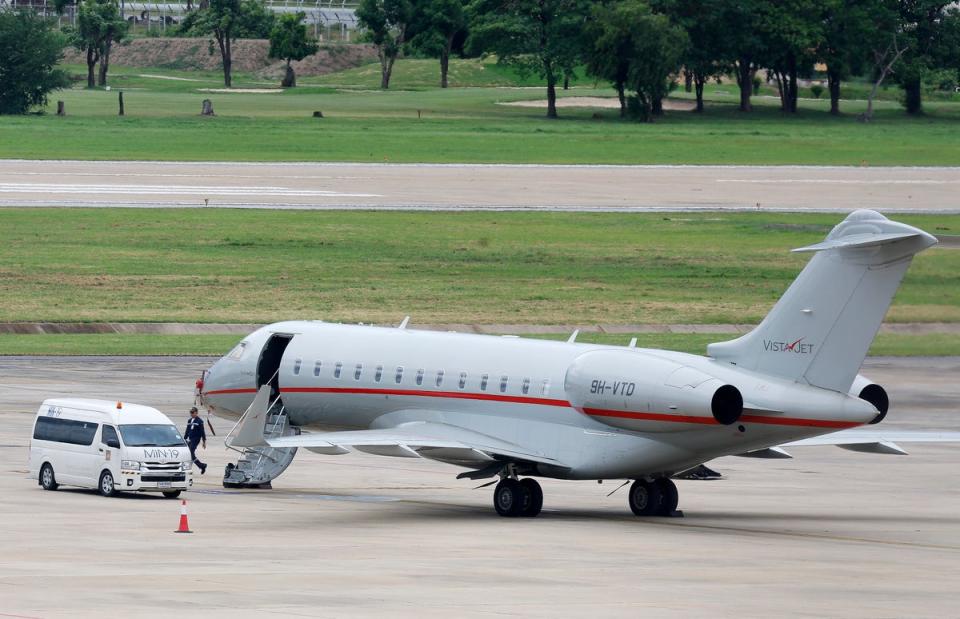 The plane carrying Assange on the tarmac at Bangkok en route to the Mariana Islands (EPA)