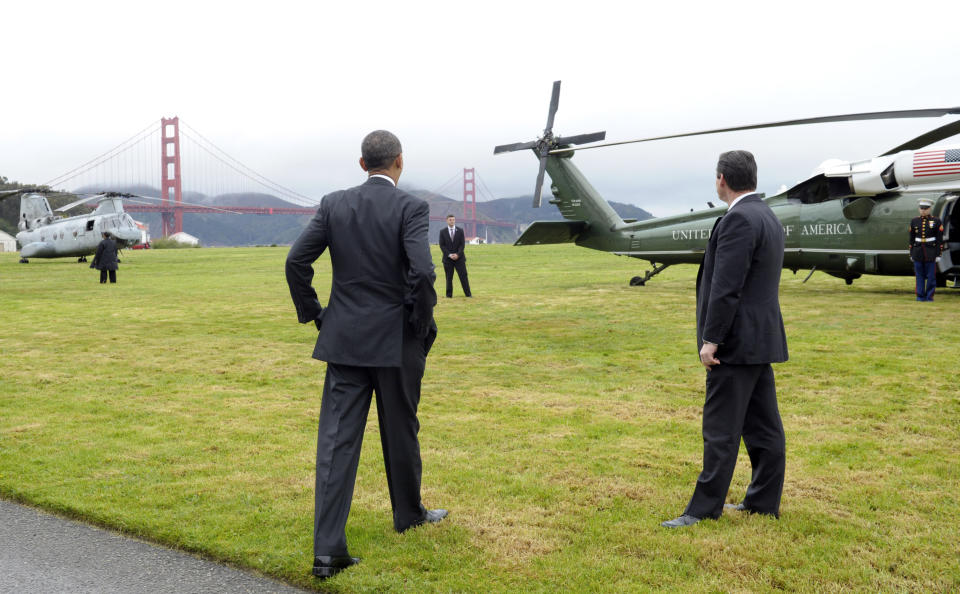 President Barack Obama looks at the Golden Gate bridge before getting on Marine One in San Francisco, Thursday, April 4, 2013. Obama will be attending Democratic fundraisers while in California. (AP Photo/Susan Walsh)