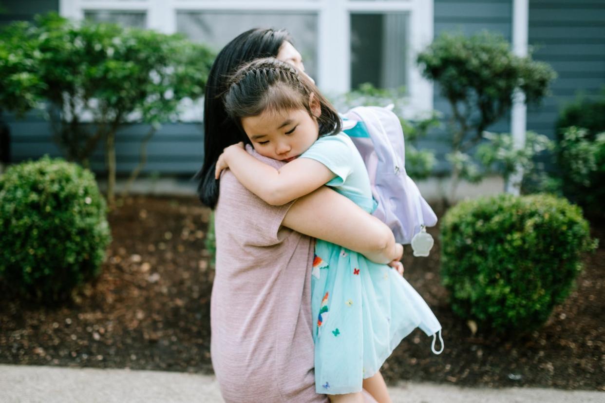 <span class="caption">Eight out of 10 Asian American youths reported being bullied and harassed during the pandemic.</span> <span class="attribution"><a class="link " href="https://www.gettyimages.com/detail/photo/girl-hugs-her-mother-on-first-day-of-school-royalty-free-image/1278034168?adppopup=true" rel="nofollow noopener" target="_blank" data-ylk="slk:RyanJLane/E+ via Getty Images;elm:context_link;itc:0;sec:content-canvas">RyanJLane/E+ via Getty Images</a></span>