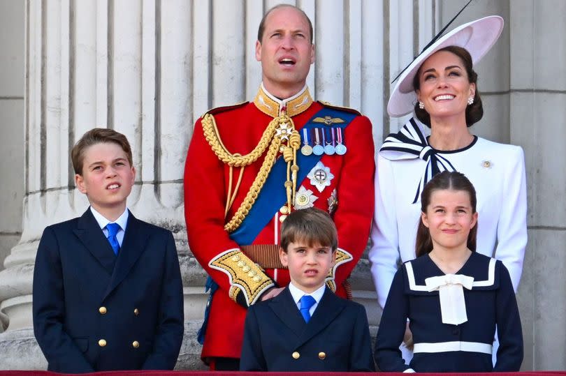 Prince William, Catherine Duchess of Cambridge, Prince George, Princess Charlotte, and Prince Louis on the balcony of Buckingham Palace