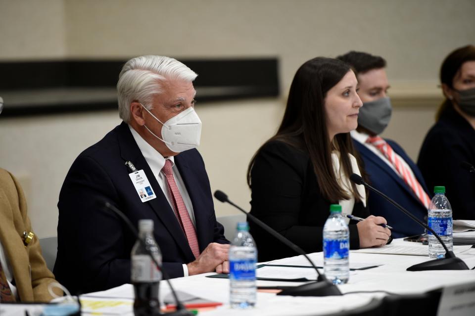 FILE - President and CEO of University Hospital Jim Davis (left) during a public hearing for the proposed merger of University Hospital and Piedmont Healthcare at University Hospital on Tuesday, Dec. 14, 2021.