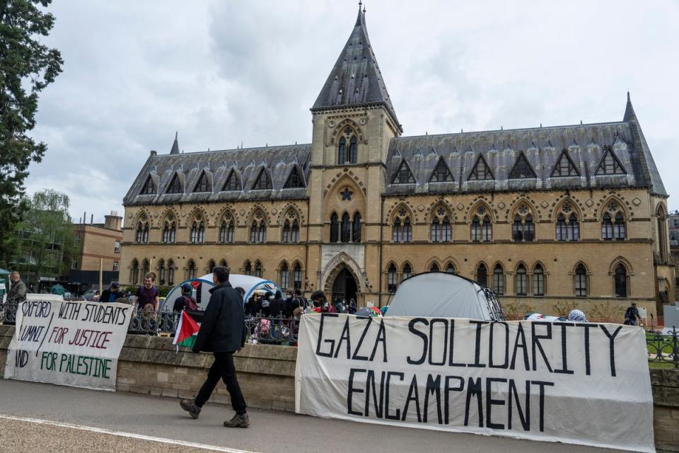 People walk past a pro-Palestine encampment set up by students at Oxford University (Getty)