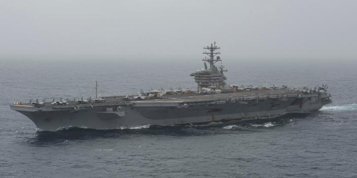 In this photo released by the U.S. Navy, the aircraft carrier USS Nimitz transits the Arabian Sea on Aug. 17, 2020.