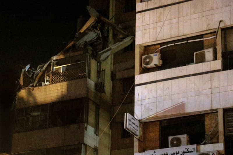 A view of a destroyed building that was targeted by an Israeli drone in Beirut's southern suburb. The Israeli military said Tuesday it has carried out a "targeted attack" on a commander of the pro-Iranian Hezbollah militia in Beirut. The explosion occurred three days after a deadly rocket attack on the Israeli-occupied Golan Heights. Marwan Naamani/dpa