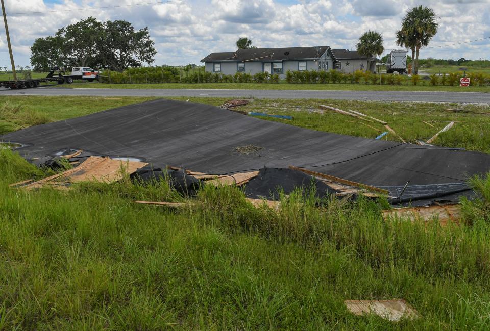 Tornado damage is seen at a home in the 14000 block of West Angle Road just outside Fort Pierce on Tuesday, June 7, 2022, in St. Lucie County. Severe weather hit the area in northern St. Lucie County Monday, with a tornado that ripped the roof off a barn at the residence, sending it over the house and across the road, along with damaging a travel trailer and a nearby FP&L power pole.