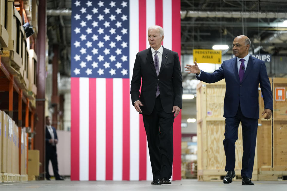 President Joe Biden listens as IBM Chairman and CEO Arvind Krishna, right, speaks during a tour of an IBM facility in Poughkeepsie, N.Y., on Thursday Oct. 6, 2022. (AP Photo/Andrew Harnik)