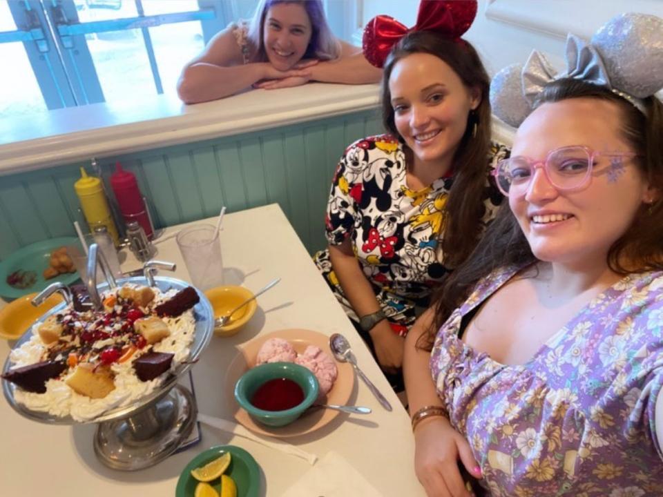 jenna and casey posing for a selfie with a kitchen sink sundae from beaches and cream at disney's beach club resort 