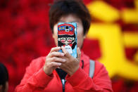 <p>A woman takes pictures of herself as people gather in Tiananmen Square to celebrate National Day marking the 67th anniversary of the founding of the People’s Republic of China, in Beijing October 1, 2016. (REUTERS/Damir Sagolj) </p>