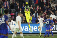 Serbia goalkeeper Dragan Rosic (12) stops a shot during the second half of an international friendly soccer match against the United States in Los Angeles, Wednesday, Jan. 25, 2023. (AP Photo/Ashley Landis)