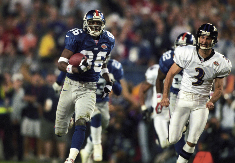 Jan 28, 2001; Tampa, FL, USA; FILE PHOTO; New York Giants receiver Ron Dixon (86) scores on a 97 yard kickoff return as Baltimore Ravens kicker Matt Stover (3) chases during Super Bowl XXXV. The Ravens defeated the Giants 34-7 at Raymond James Stadium. Mandatory Credit: USA TODAY Sports