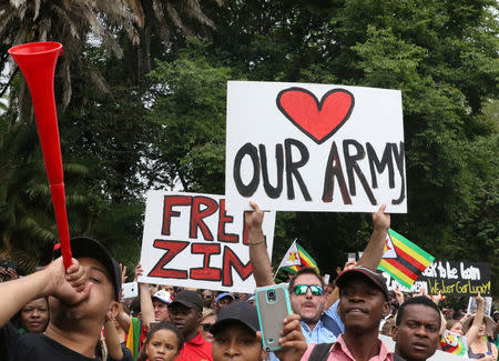 Protesters calling for Zimbabwean President Robert Mugabe to step down take to the streets in Harare, Zimbabwe, November 18, 2017. REUTERS/Philimon Bulawayo