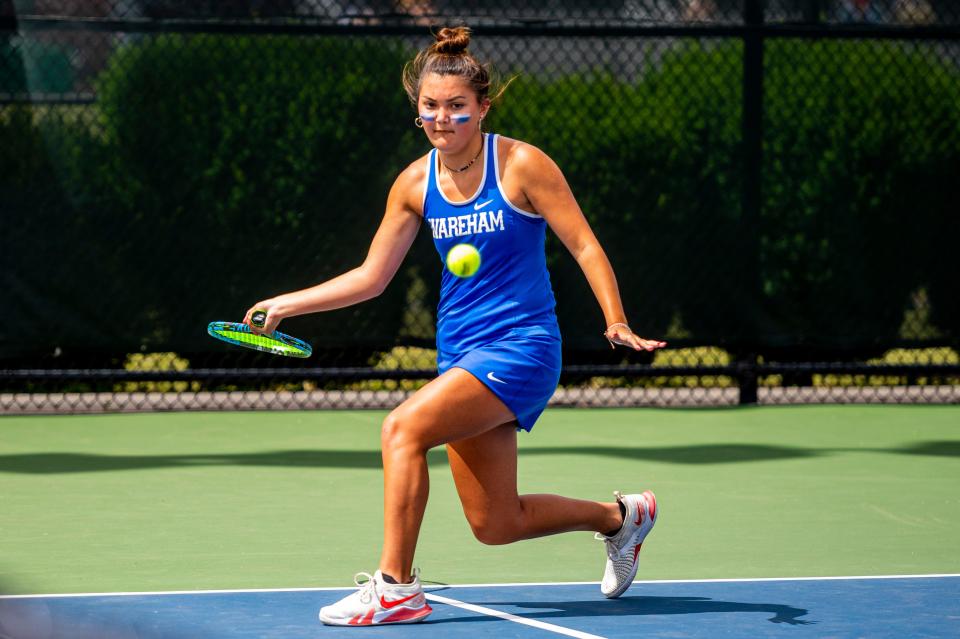 Wareham's Brooklyn Bindas moves along the baseline for the forehanded return against  Hamilton-Wenham's Sky Jara in the first singles matchup in the Division 4 State Finals.