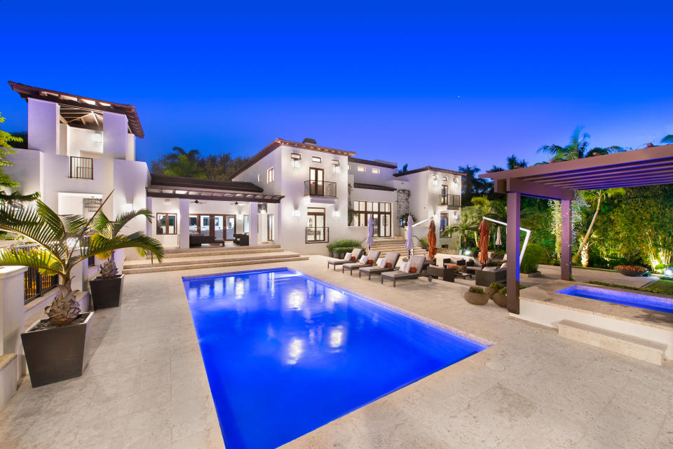 The yard has a putting green, a resort-style heated pool and a five-car garage. Photo by: Platinum Luxury Auctions.