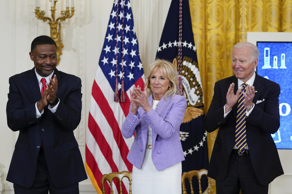 President Joe Biden, first lady Jill Biden and 2022 National Teacher of the Year Kurt Russell applaud the 2022 National and State Teachers of the Year during an event in the East Room of the White House in Washington, Wednesday, April 27, 2022. (AP Photo/Susan Walsh)