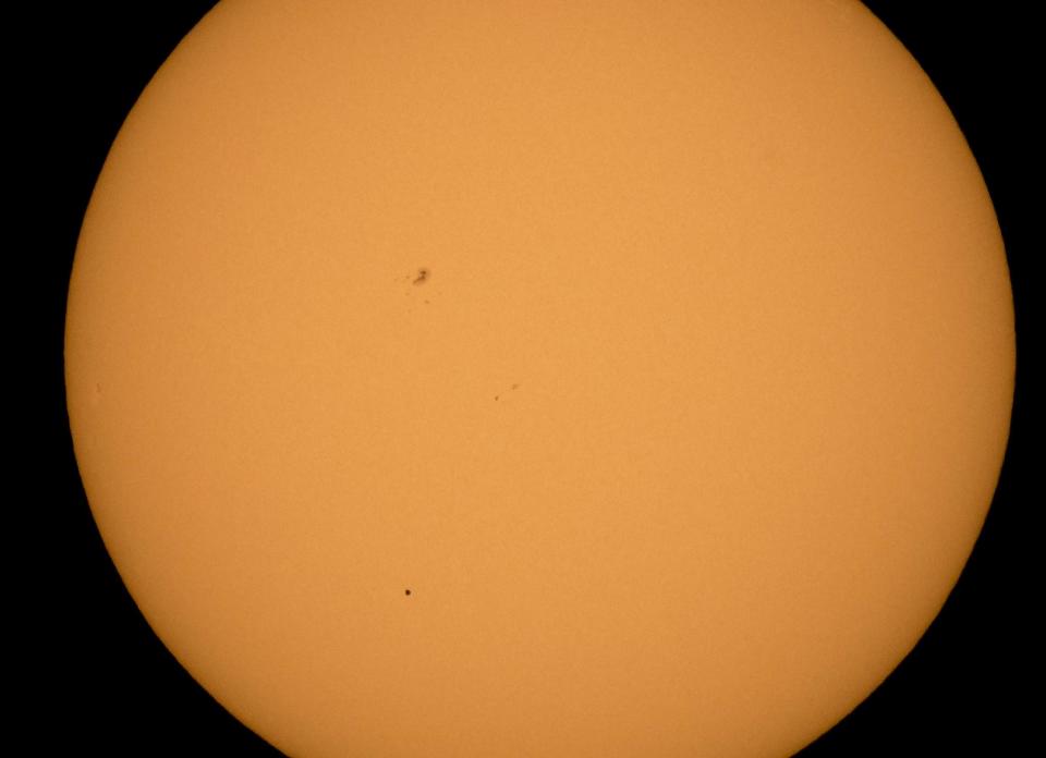 The planet Mercury is seen in silhouette, lower third of image, as it transits across the face of the sun Monday, May 9, 2016, as viewed from Boyertown, Pennsylvania: NASA/Bill Ingalls