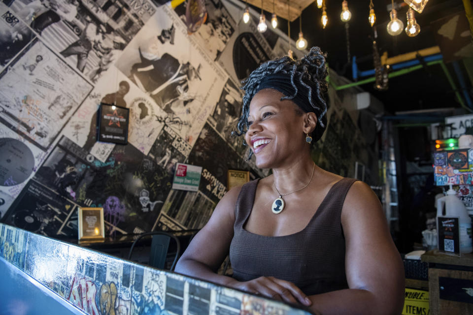 Majora Carter, owner of the Boogie Down Grind, poses for a portrait in the Bronx in New York on Monday, July 24, 2023, in New York. Hip-hop rose from the ashes of a borough ablaze with poverty, urban decay and gang violence. From breaking to graffiti “writing” to MC-ing or rapping, the block parties and various elements of hip-hop served as an outlet for creativity and an escape from the hardships of daily life. Carter, 56, said “I do find it ironic that one of the richest parts of American culture comes from a place that is still one of the poorest parts of our country.” (AP Photo/Brittainy Newman)