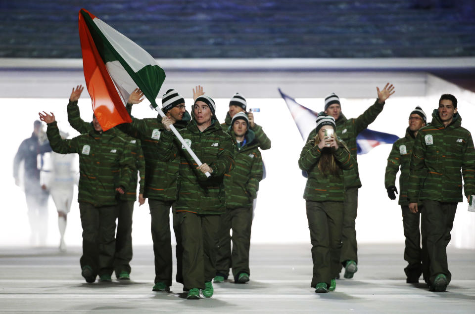 Conor Lyne of Ireland carries the national flag as he leads the team during the opening ceremony of the 2014 Winter Olympics in Sochi, Russia, Friday, Feb. 7, 2014. (AP Photo/Mark Humphrey)