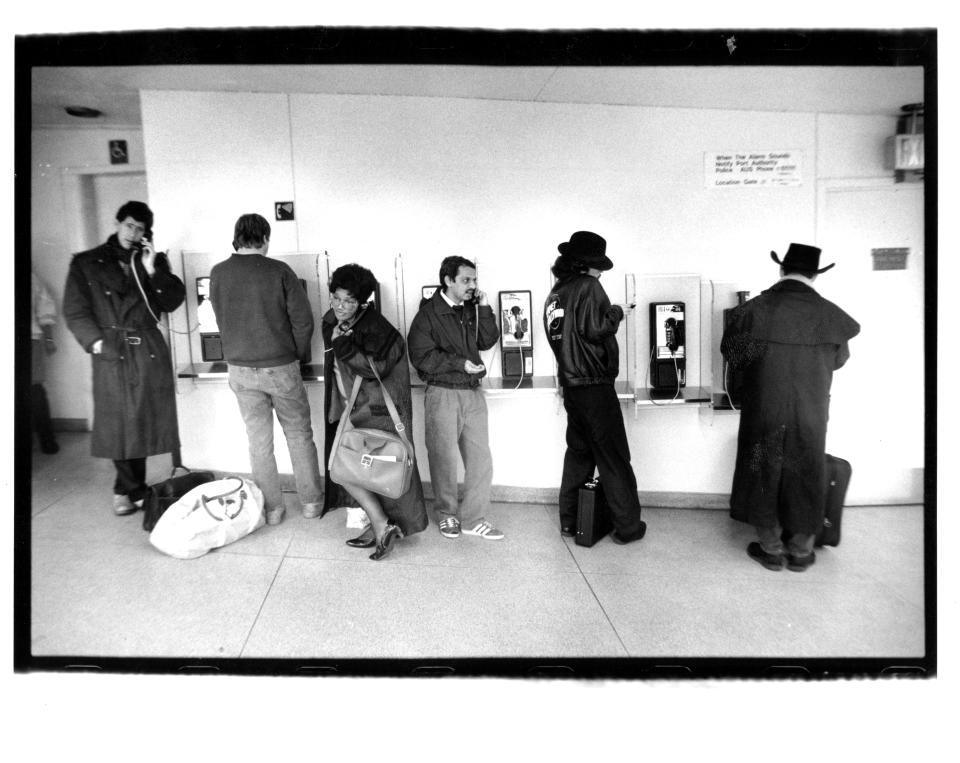 Airplane passengers look through windows at airplanes being de-iced and plows at work&nbsp;at La Guardia airport on Feb. 11, 1994.&nbsp;