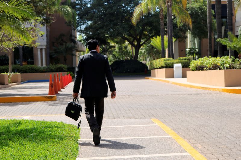 FILE PHOTO: A man enters a hotel where a man who tested positive for coronavirus is being treated, according to local authorities, in Culiacan