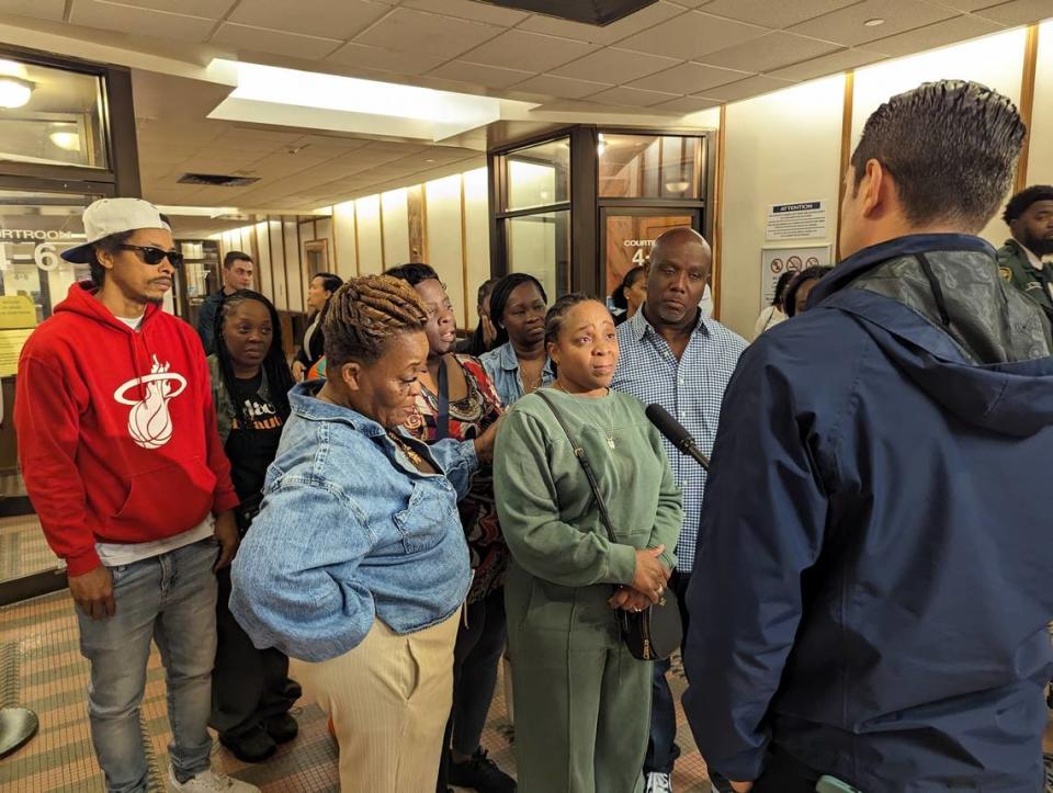 Tangela Johnson, Kayla Gloster’s mother, speaks to the media after the verdict Wednesday, April 17, 2024, in the Miami-Dade courthouse. Robert Holton II was sentenced to life in prison in the November 2013 death of Gloster, a 22-year-old woman who was killed in her Naranja apartment in South Miami-Dade. Johnson is surrounded by family, including Kayla’s grandmother, Caron Dickson, to her right.