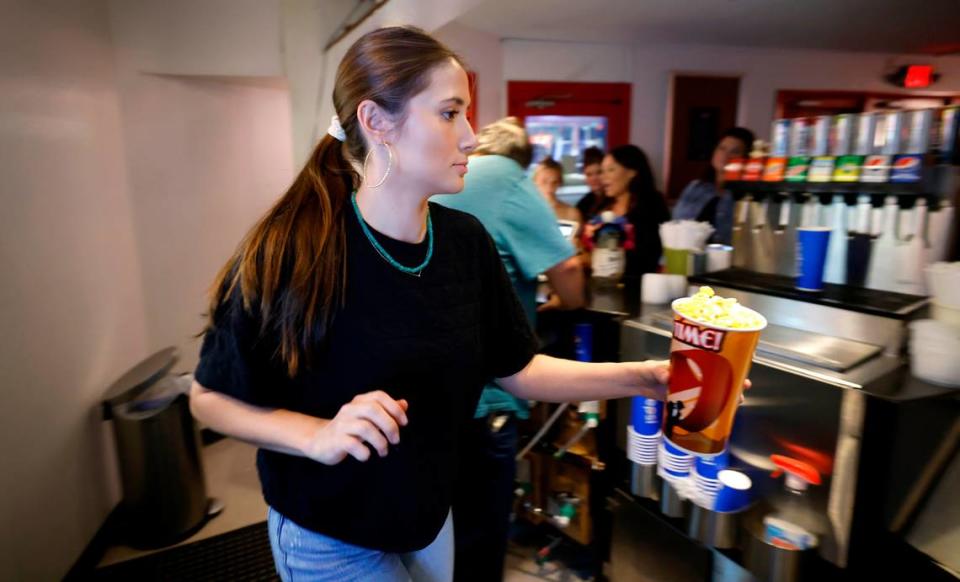 Jade Enns sells popcorn before a showing of the Rocky Horror Picture Show at the Rialto Theater in Raleigh, N.C., Friday evening, Oct. 27, 2023.