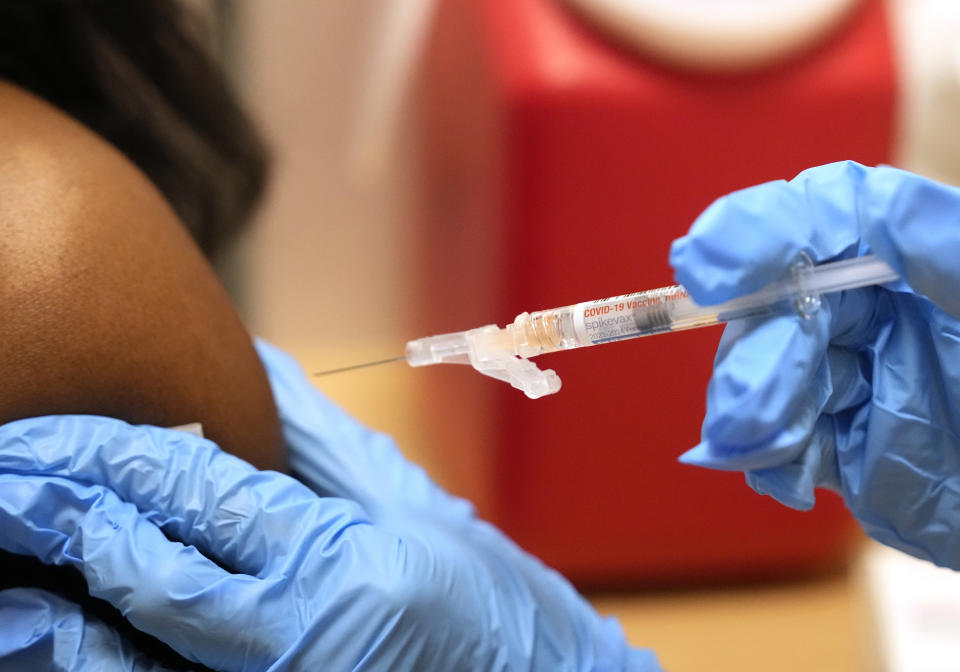 A pharmacist administers a Moderna Spikevax COVID-19 vaccine at a drug store, Wednesday, Sept. 20, 2023, in Cypress, Texas. Fall 2023 vaccination season is in full swing, with health officials in the U.S. urging both an updated COVID-19 shot and flu vaccine for most everyone. New this year are vaccines for older adults and women in late pregnancy to guard against another virus named RSV. (Melissa Phillip/Houston Chronicle via AP)