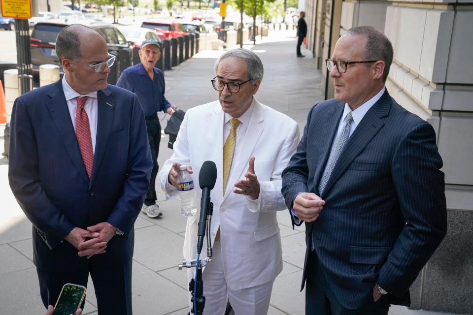 Attorneys for Oath Keepers founder Stewart Rhodes, Phillip Linder, left, Ed Tarpley, center and Lee James Bright, right, speak to reporters after his sentencing.