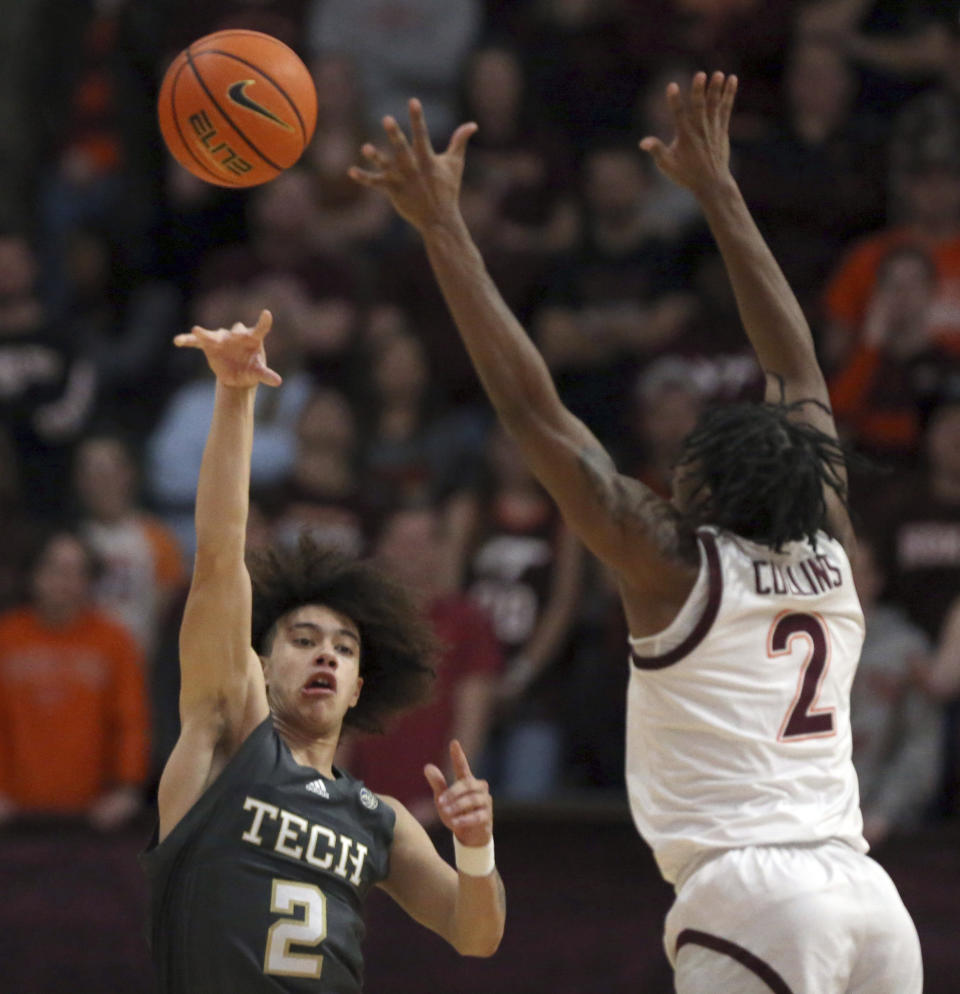 Georgia Tech's Naithan George (2) passes after getting a turnover from Virginia Tech's MJ Collins (2) in the first half of an NCAA college basketball game, Saturday, Jan. 27, 2024, in Blacksburg, Va. (Matt Gentry/The Roanoke Times via AP)