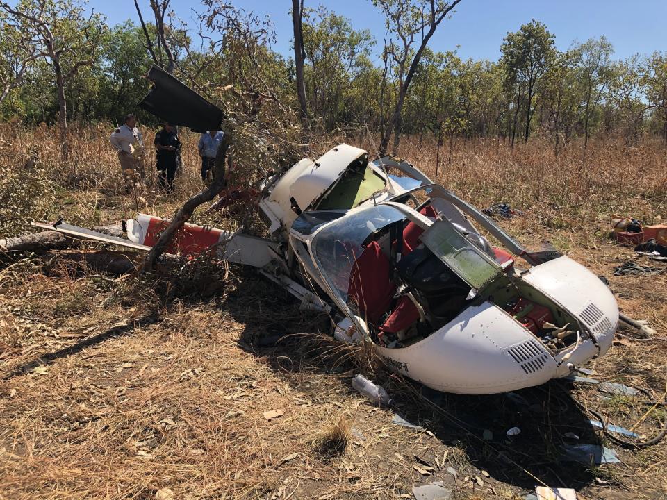 A smashed up helicopter on the ground of Kakadu National Park after crash. Source: NT Police