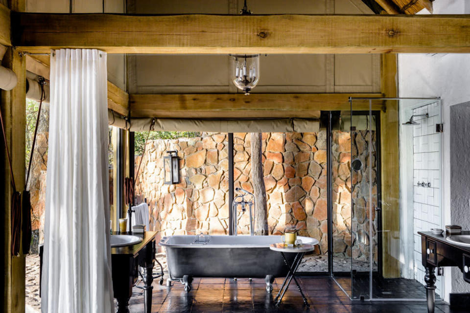 <p>The clawfoot tub is the centerpiece at this luxe safari hotel.  (Photo: Singita)</p>